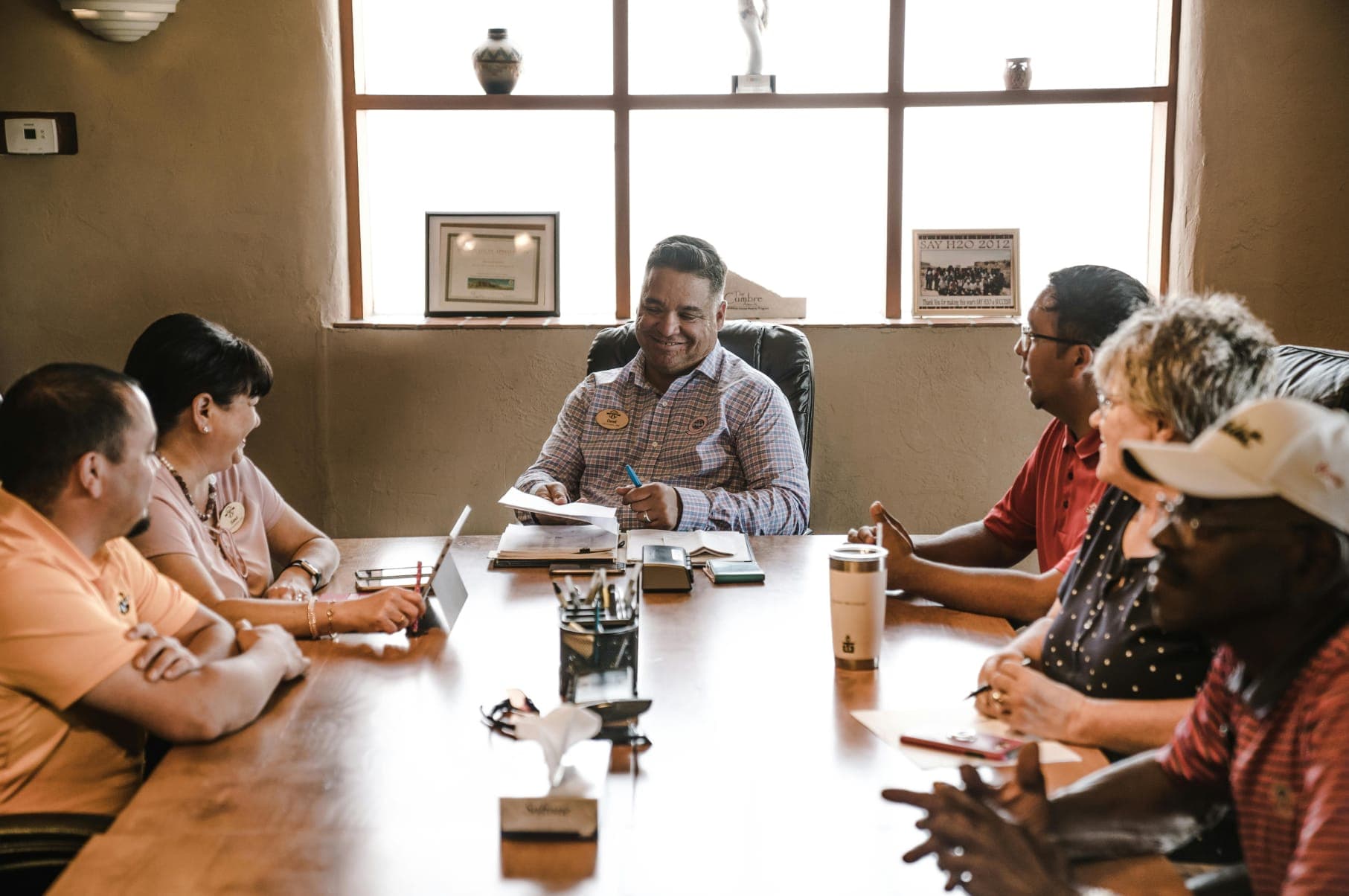 Group of people having a discussion in a boardroom