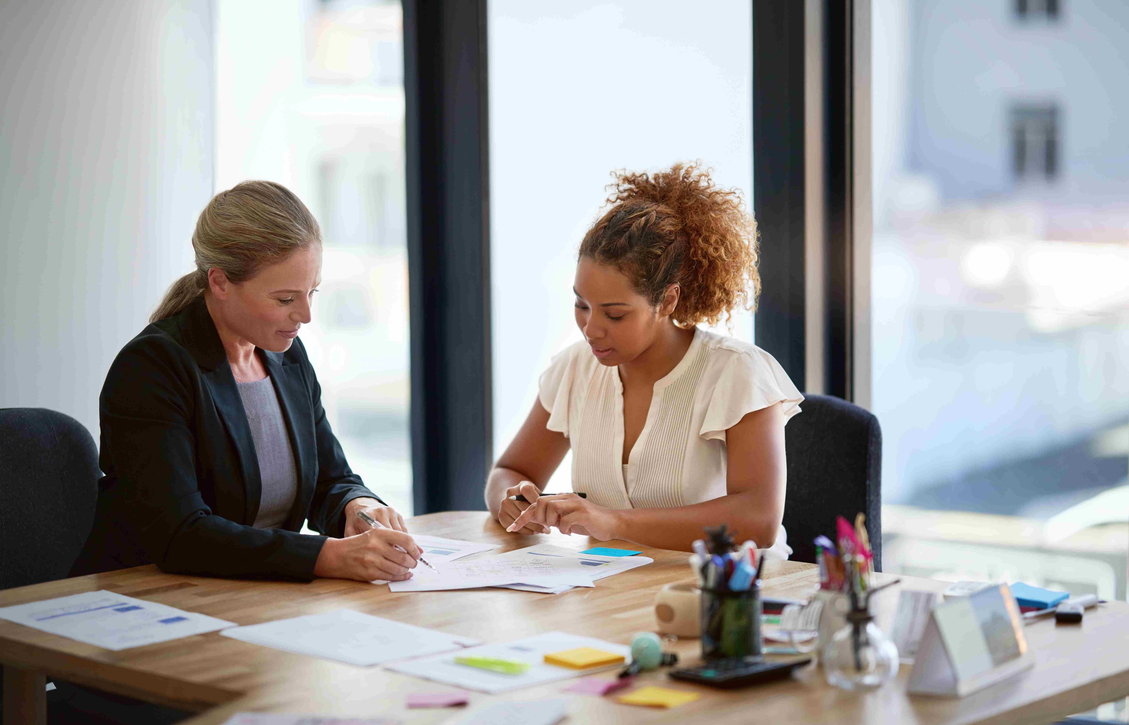 Two women working together