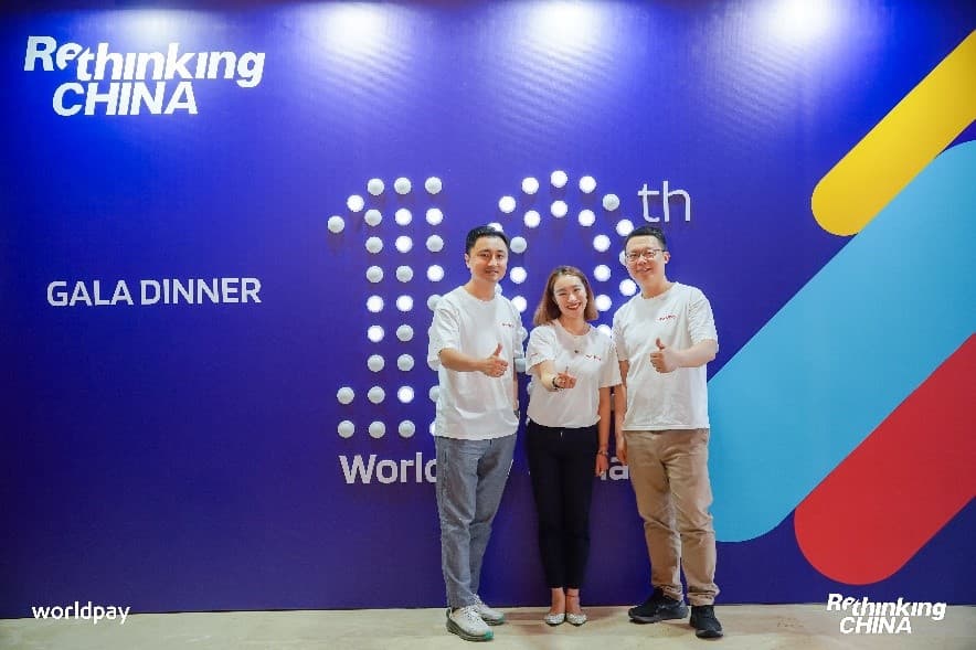 Three team members at event