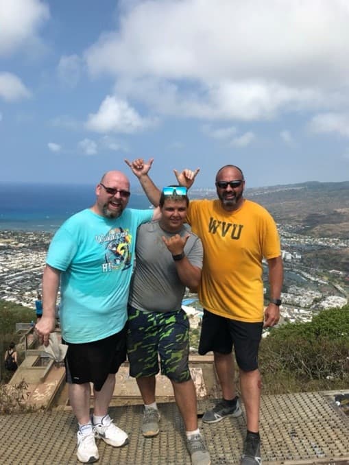3 men standing on an overview