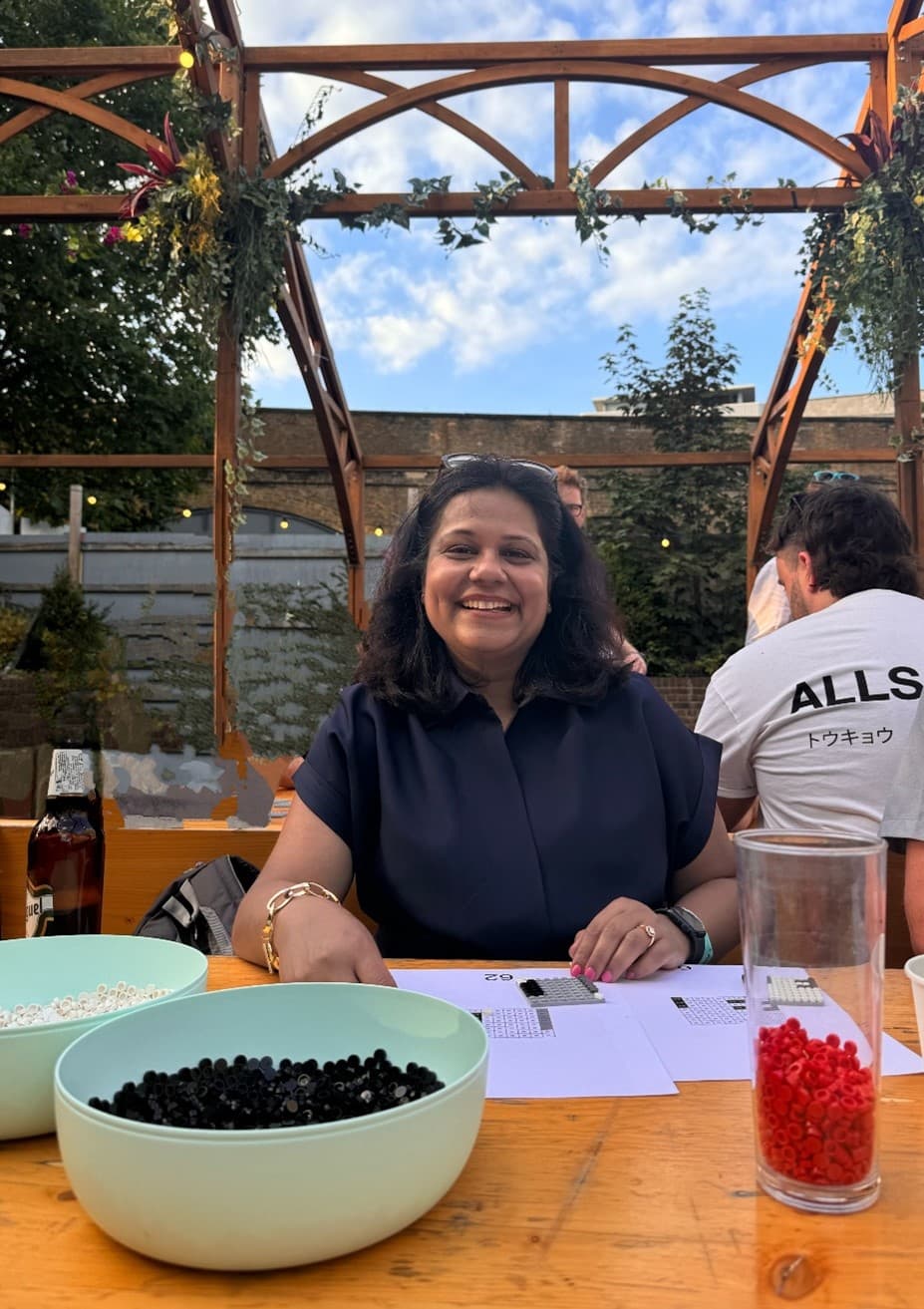 woman smiling at table