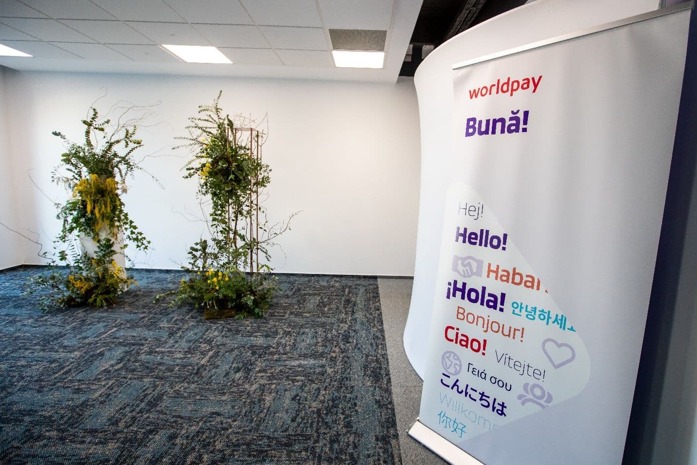 office welcome sign with green plants