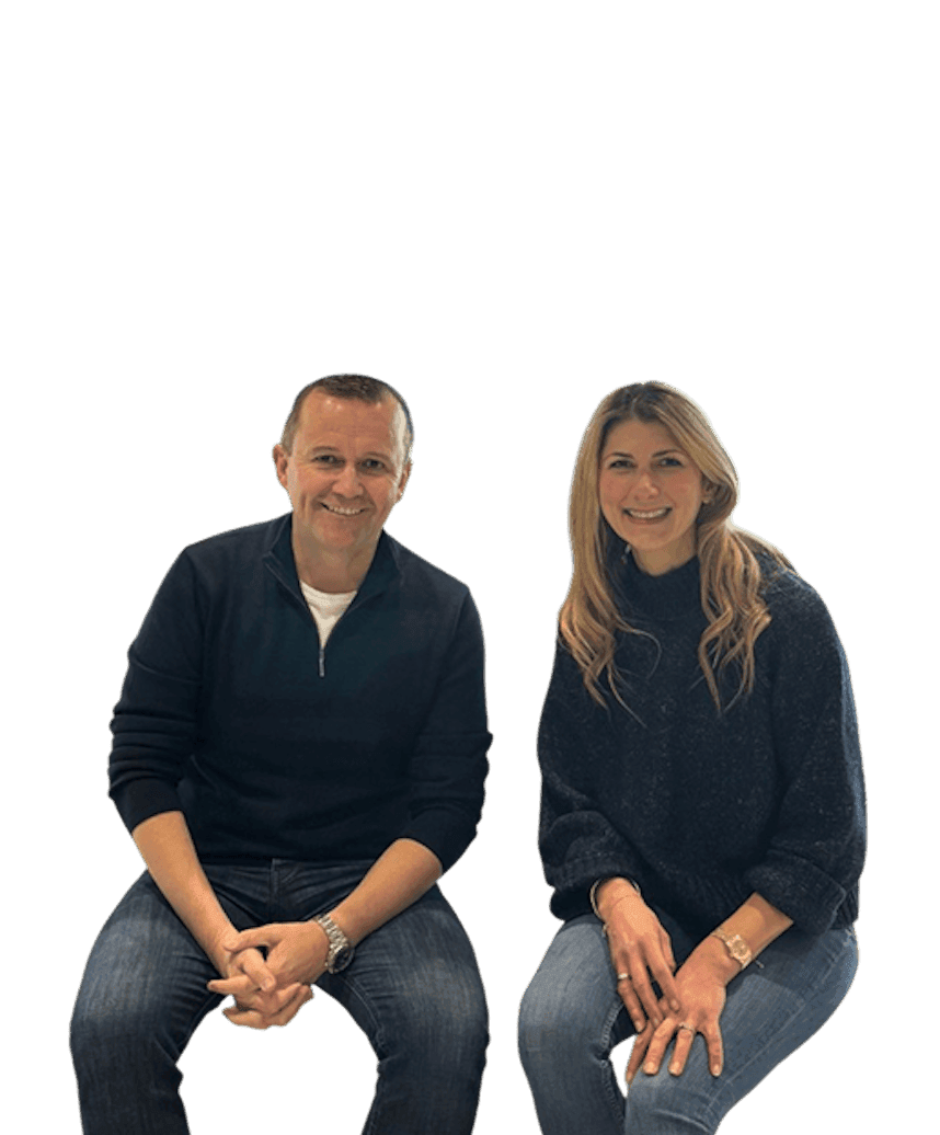 Man and woman sitting next to each other smiling