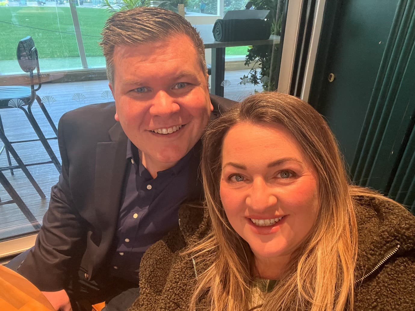 man and woman smiling for picture