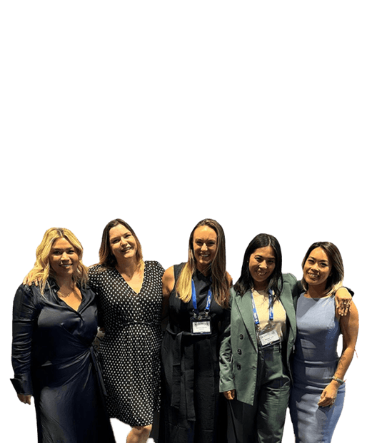 Group of 5 women with their arms around each other smiling