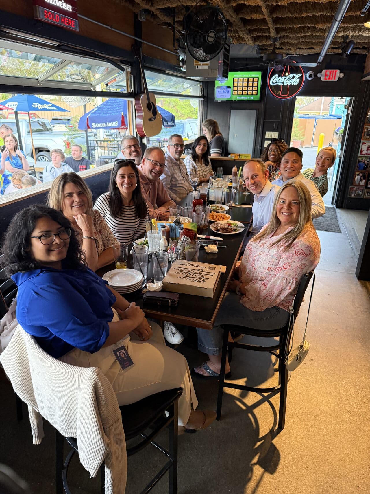 colleagues sitting around a table eating