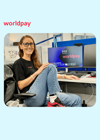 women at desk in branded gear