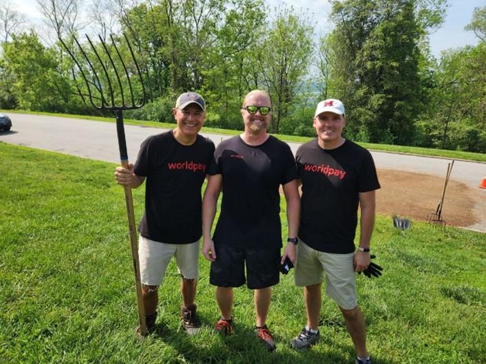 3 men smiling for photo