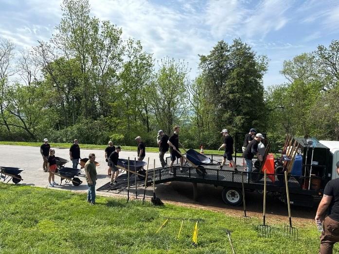 colleagues gathering gardening materials