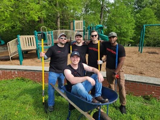 5 colleagues posing for photo