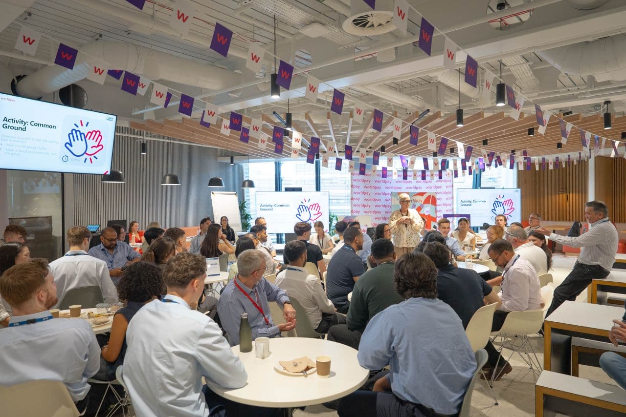 group of graduates sitting in cafeteria