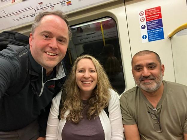 three people on London tube